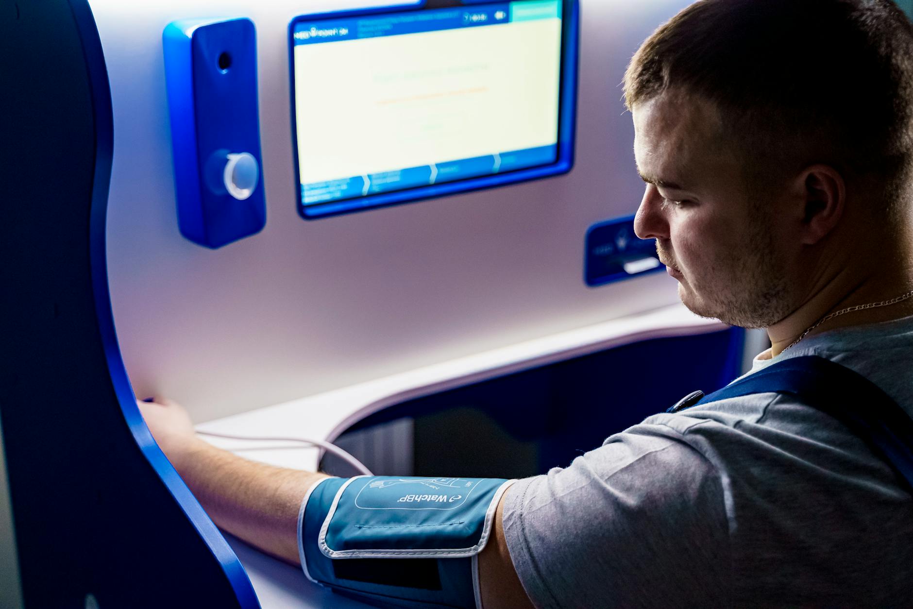 a man measuring his blood pressure digitally