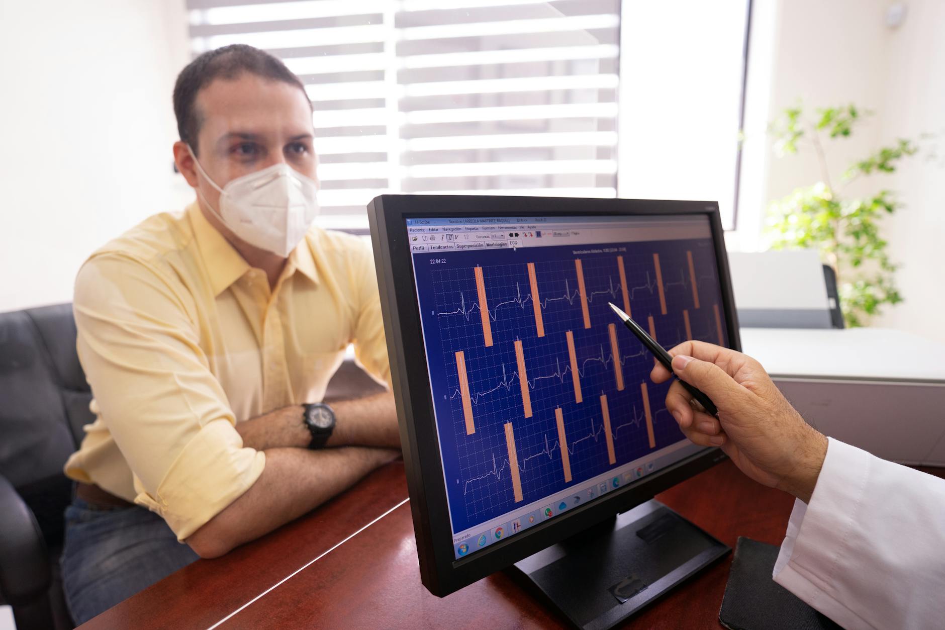 a doctor checking a patient s ecg results